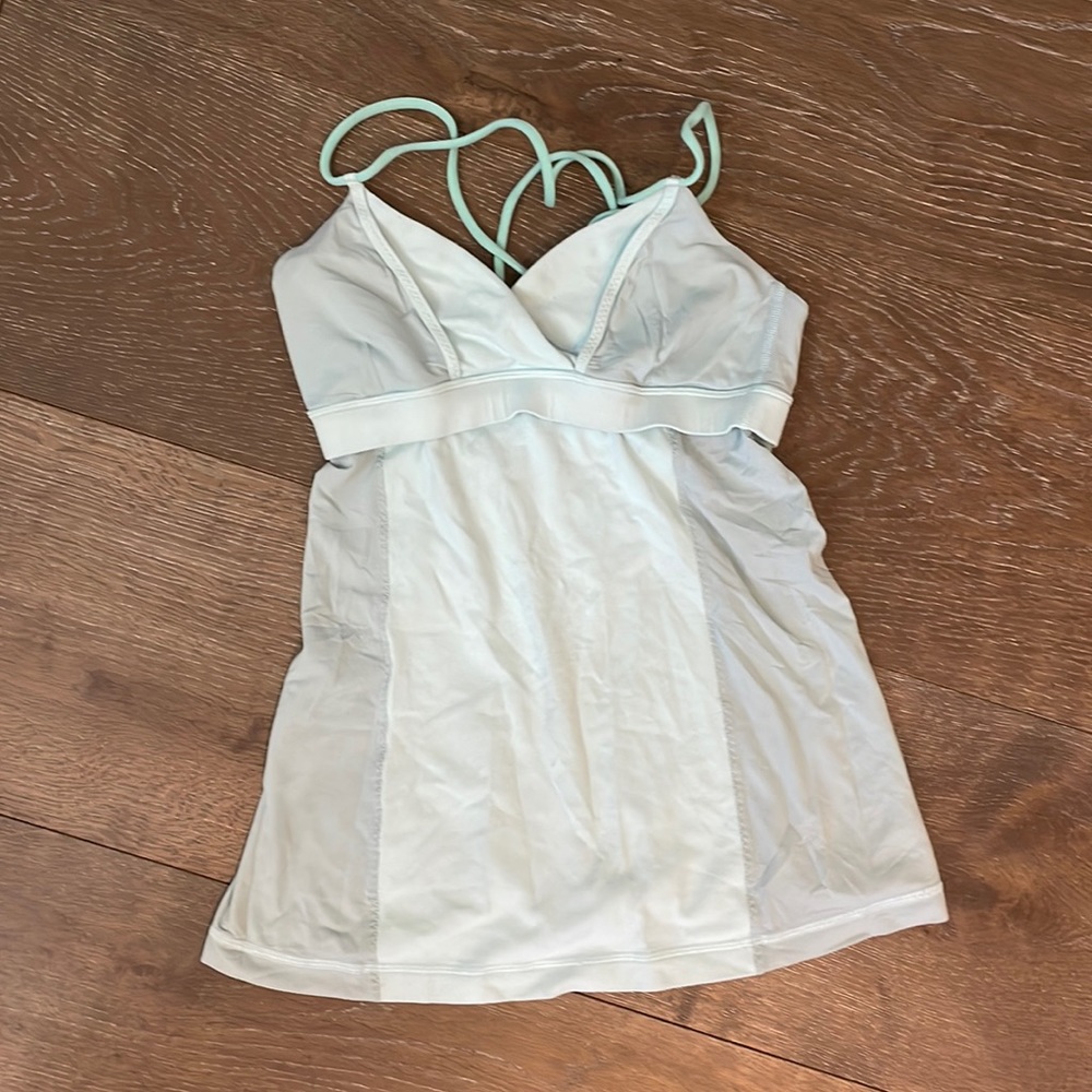 Lulu sport tank with built in bra and cross back in a light sea foam color